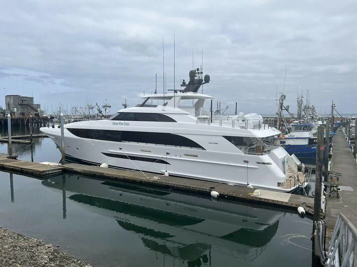 a white yacht docked at a pier aboard SEAS THE DAY Yacht for Sale