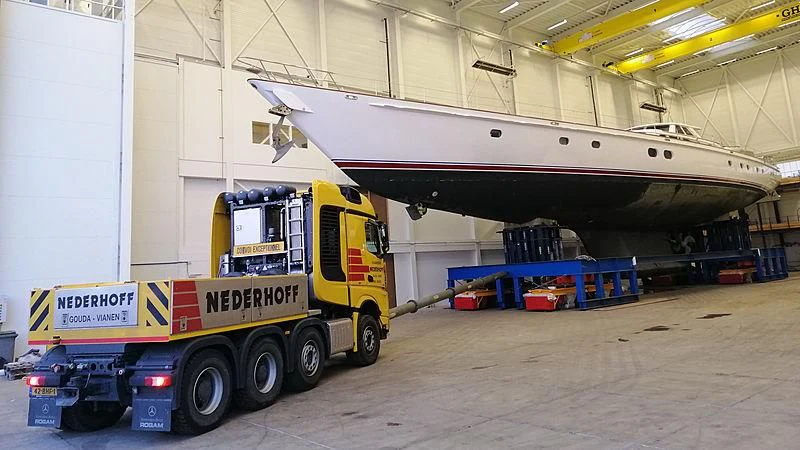 a large truck is parked in a warehouse aboard JULIET Yacht for Sale