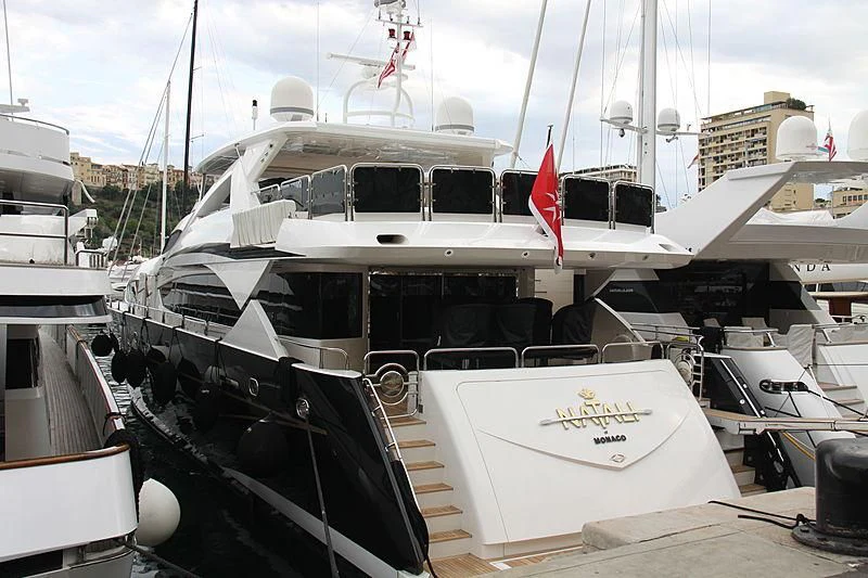 a boat with a flag on the front aboard NATALI OF MONACO Yacht for Sale