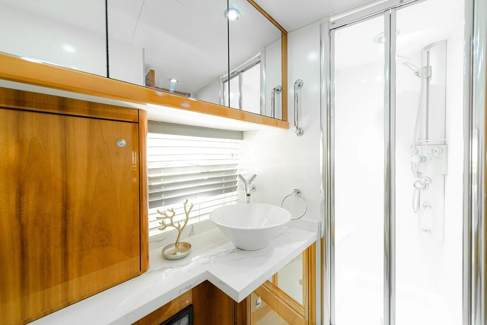 a bathroom with a sink and a mirror aboard SOUL MATES Yacht for Sale