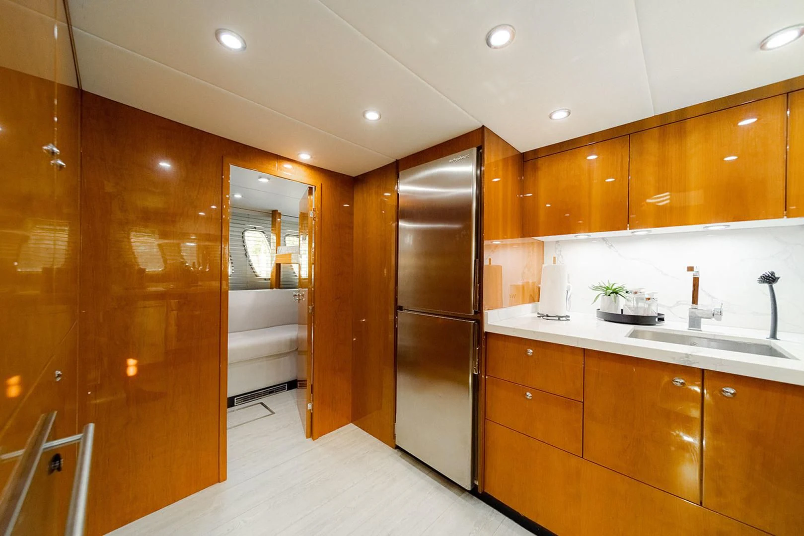 a kitchen with wooden cabinets aboard SOUL MATES Yacht for Sale
