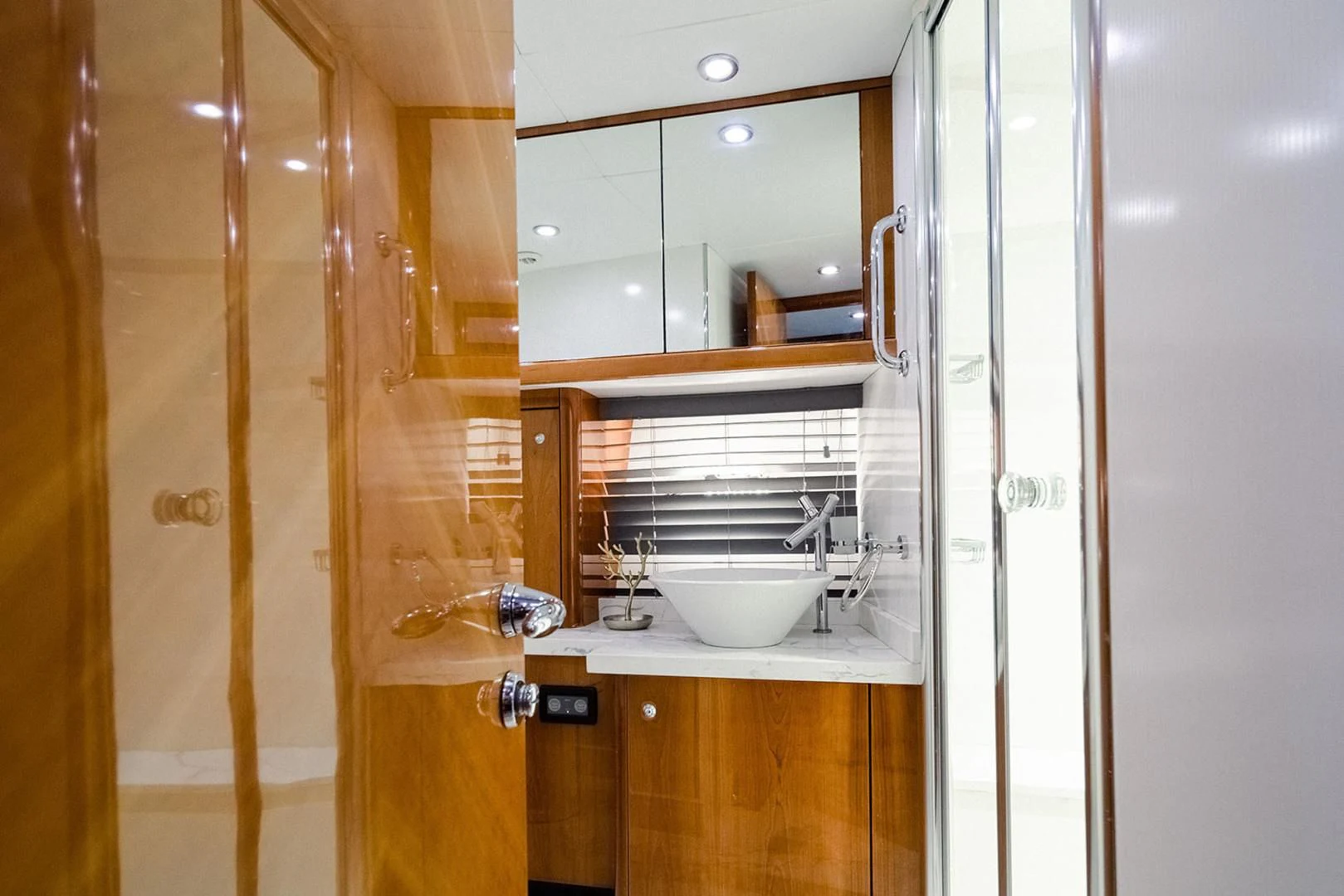 a bathroom with a sink and a mirror aboard SOUL MATES Yacht for Sale