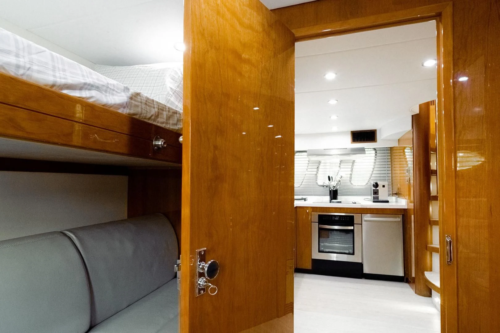 a room with a couch and a bed aboard SOUL MATES Yacht for Sale