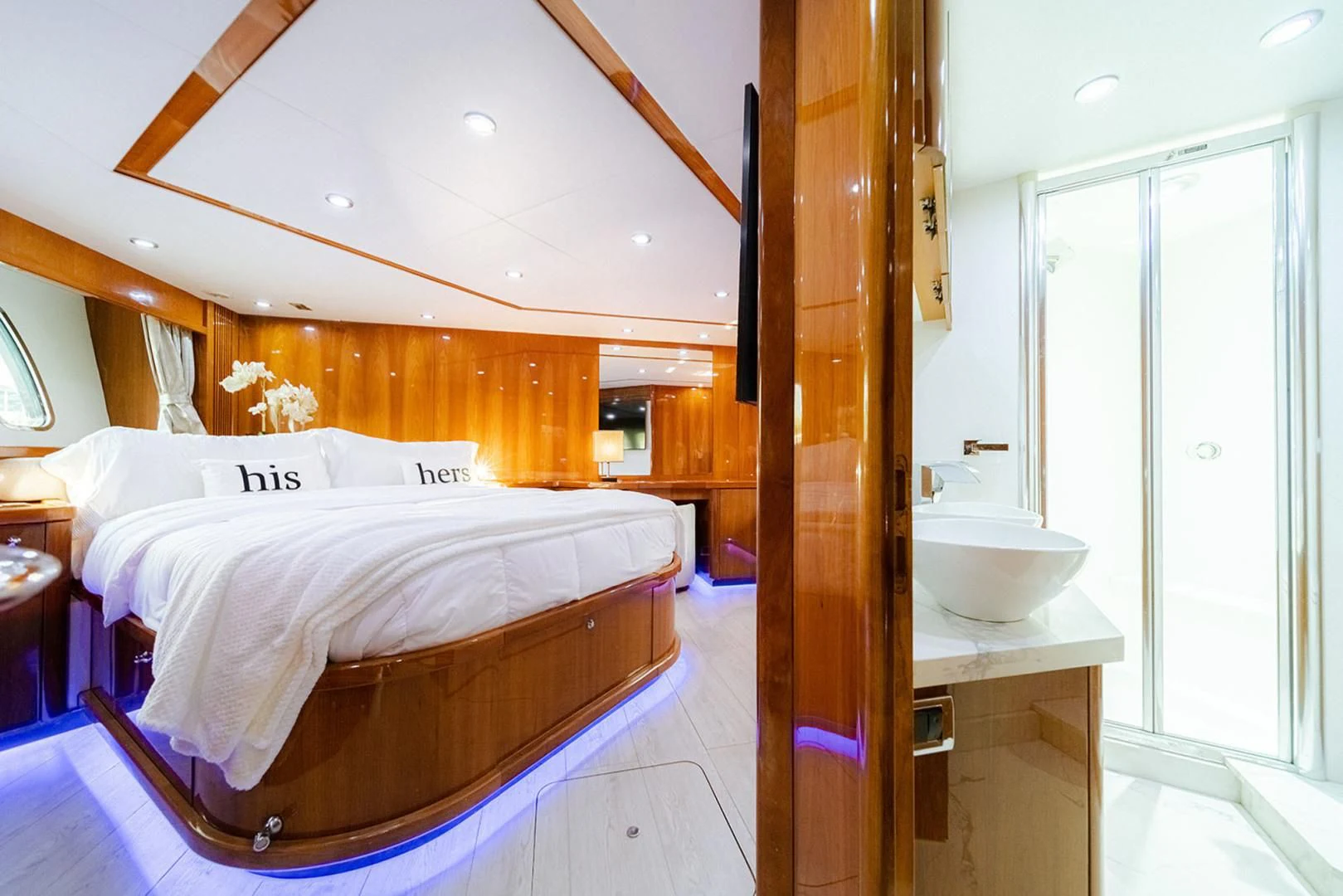 a bedroom with a bed and a sink aboard SOUL MATES Yacht for Sale