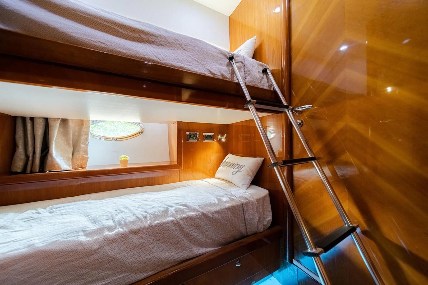 a bed with a wooden frame aboard SOUL MATES Yacht for Sale