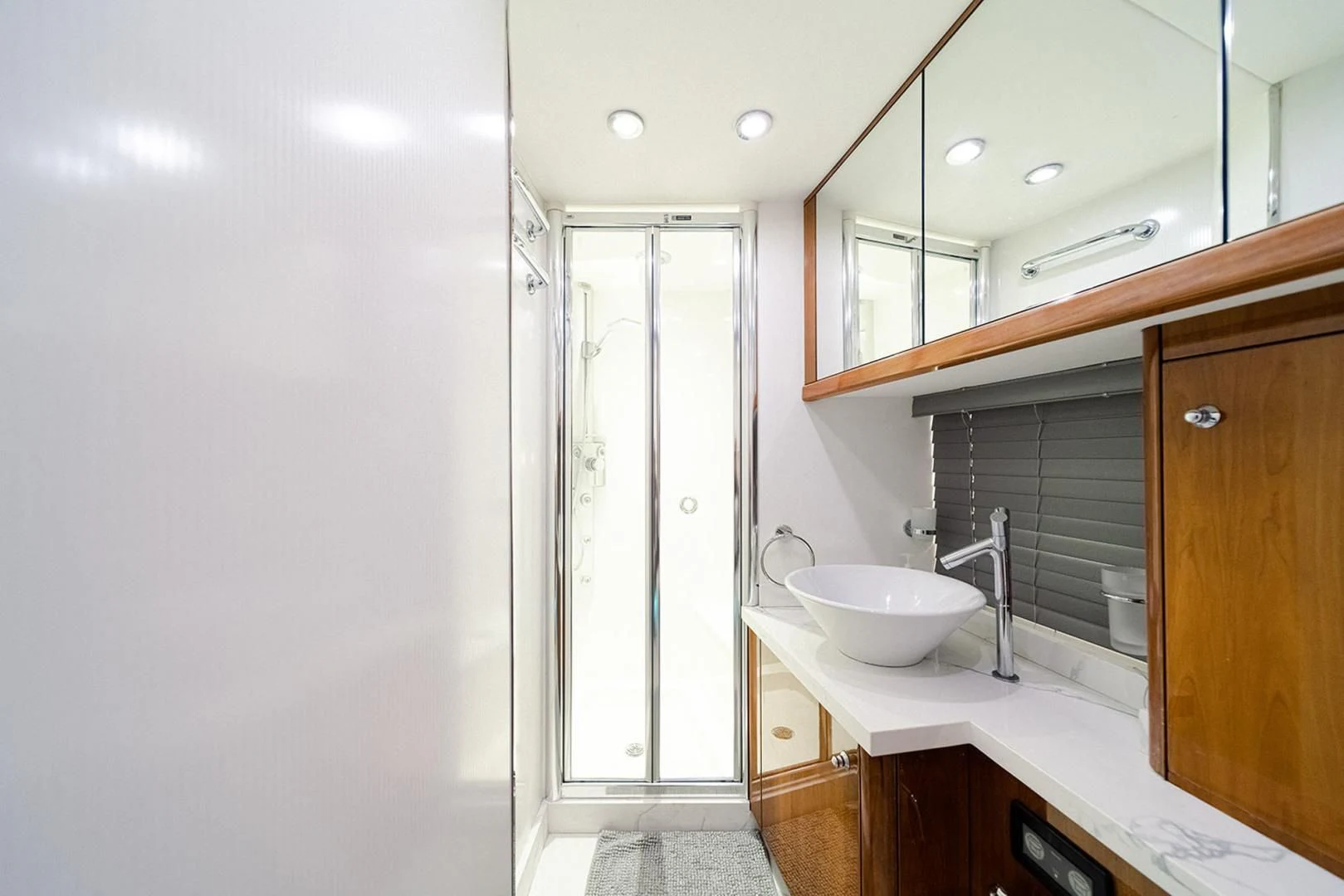 a bathroom with a sink and a mirror aboard SOUL MATES Yacht for Sale