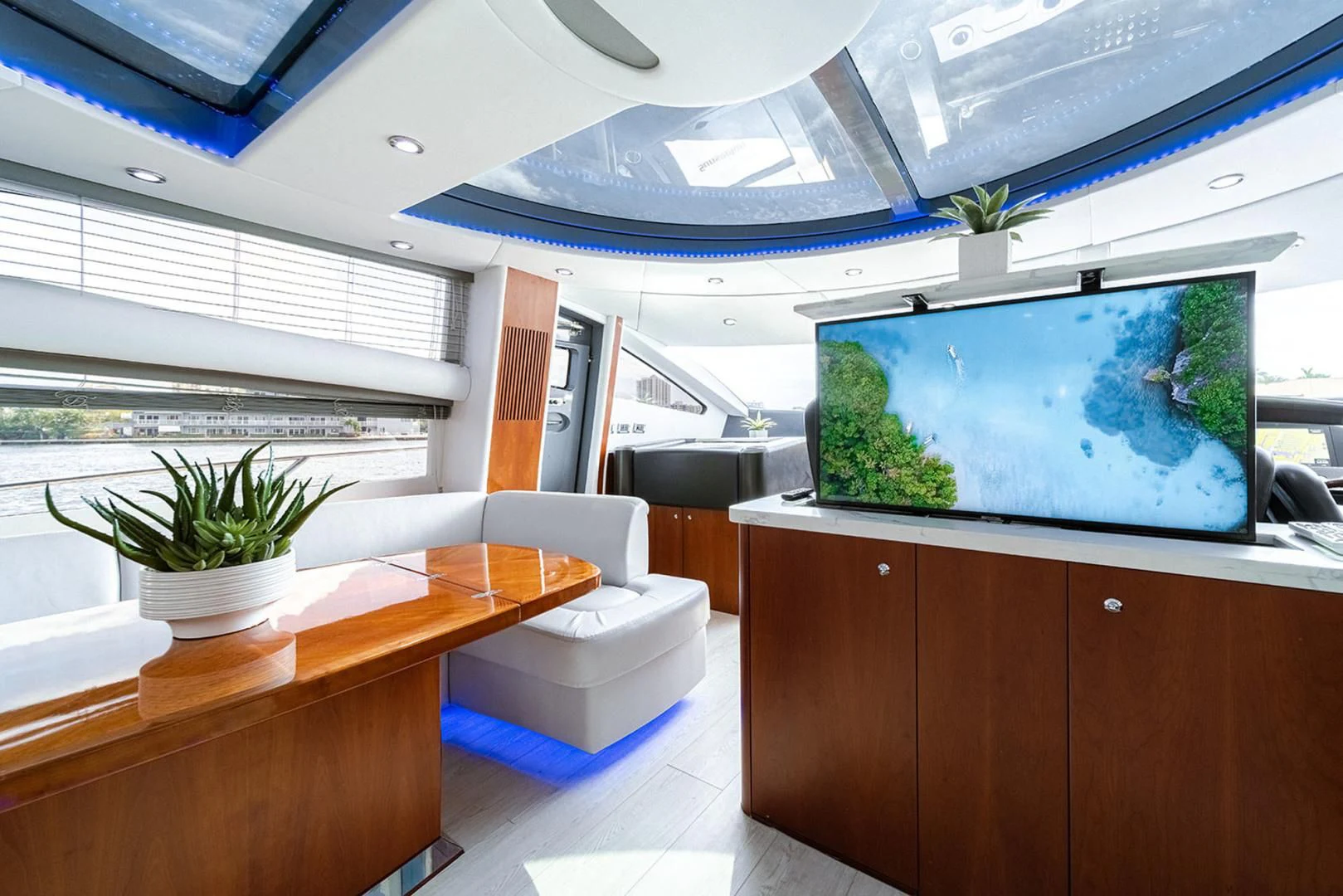 a room with a large screen aboard SOUL MATES Yacht for Sale