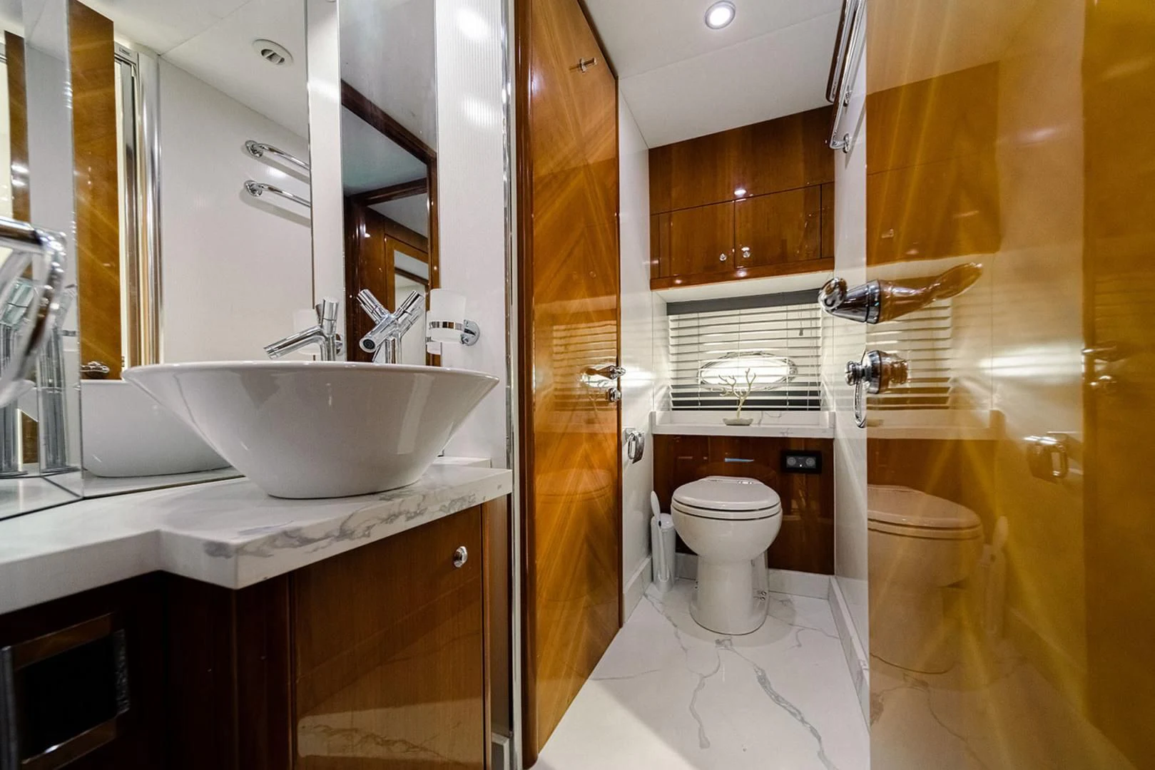 a bathroom with a sink and toilet aboard SOUL MATES Yacht for Sale
