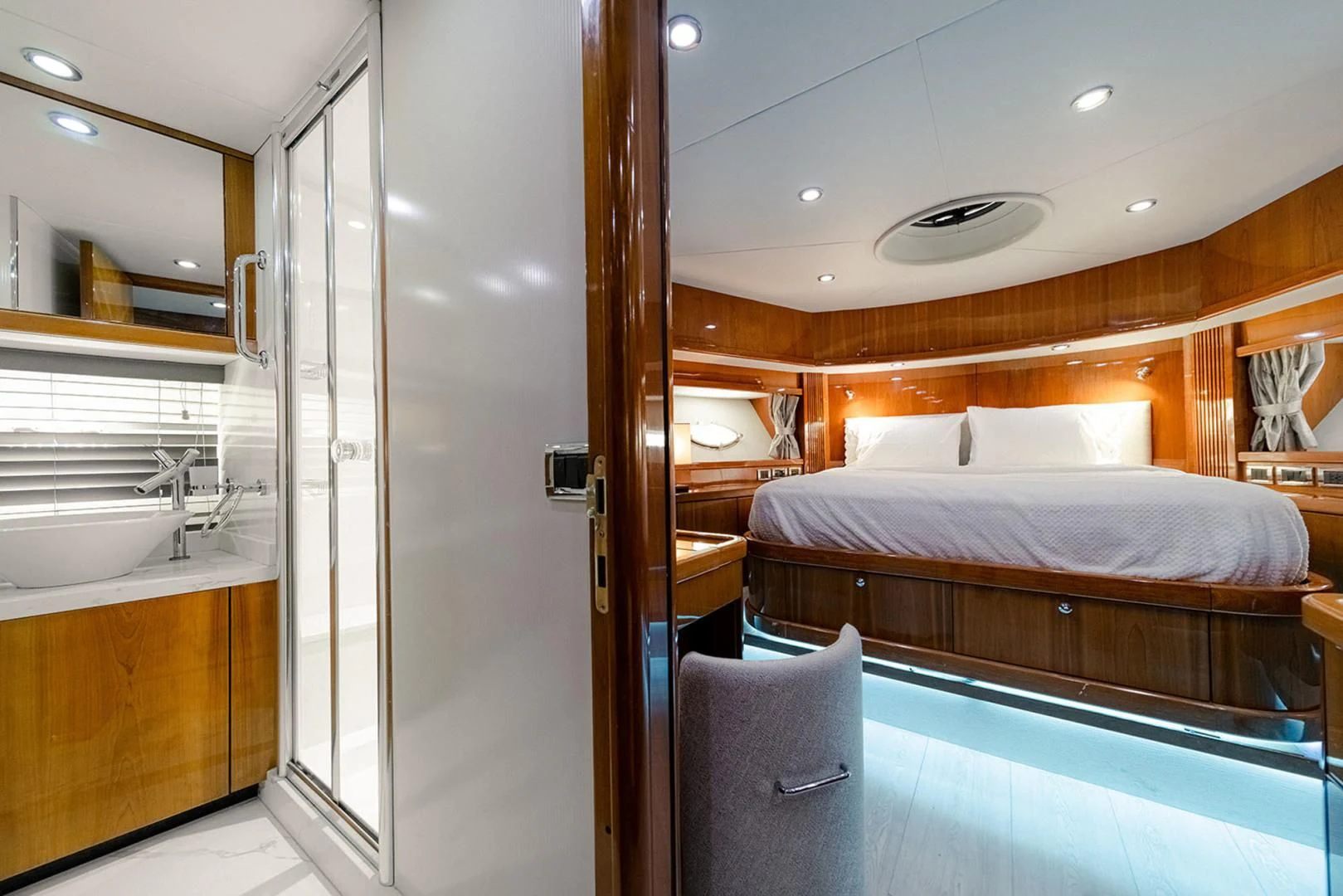 a bedroom with a bed and a sink aboard SOUL MATES Yacht for Sale