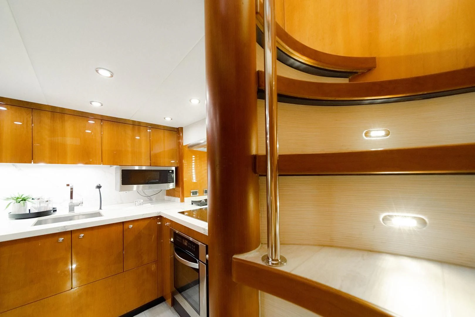a kitchen with wooden cabinets aboard SOUL MATES Yacht for Sale