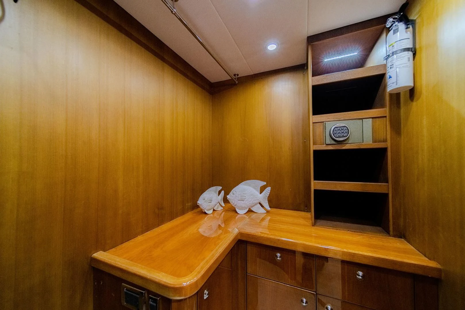 a room with wooden cabinets and a shelf with objects on it aboard SOUL MATES Yacht for Sale
