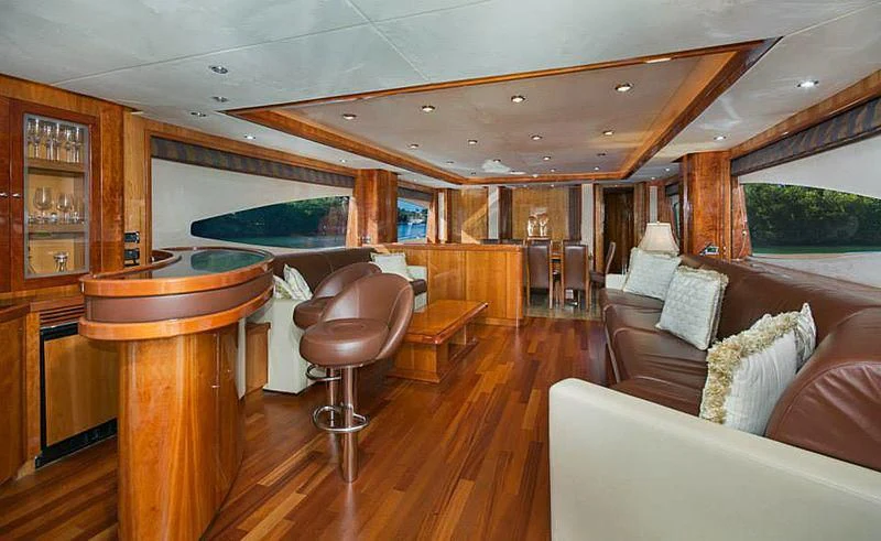 a living room with a bar and bar aboard DELFINO Yacht for Sale