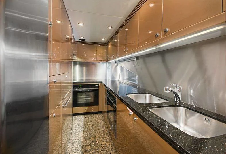 a kitchen with stainless steel appliances aboard DELFINO Yacht for Sale