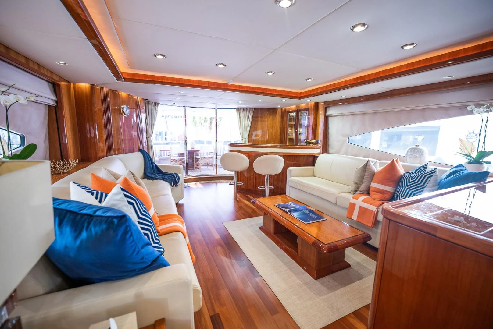 a living room with a large window aboard DELFINO Yacht for Sale