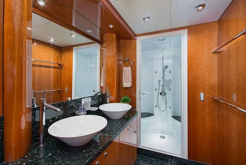 a bathroom with a sink and a shower aboard DELFINO Yacht for Sale
