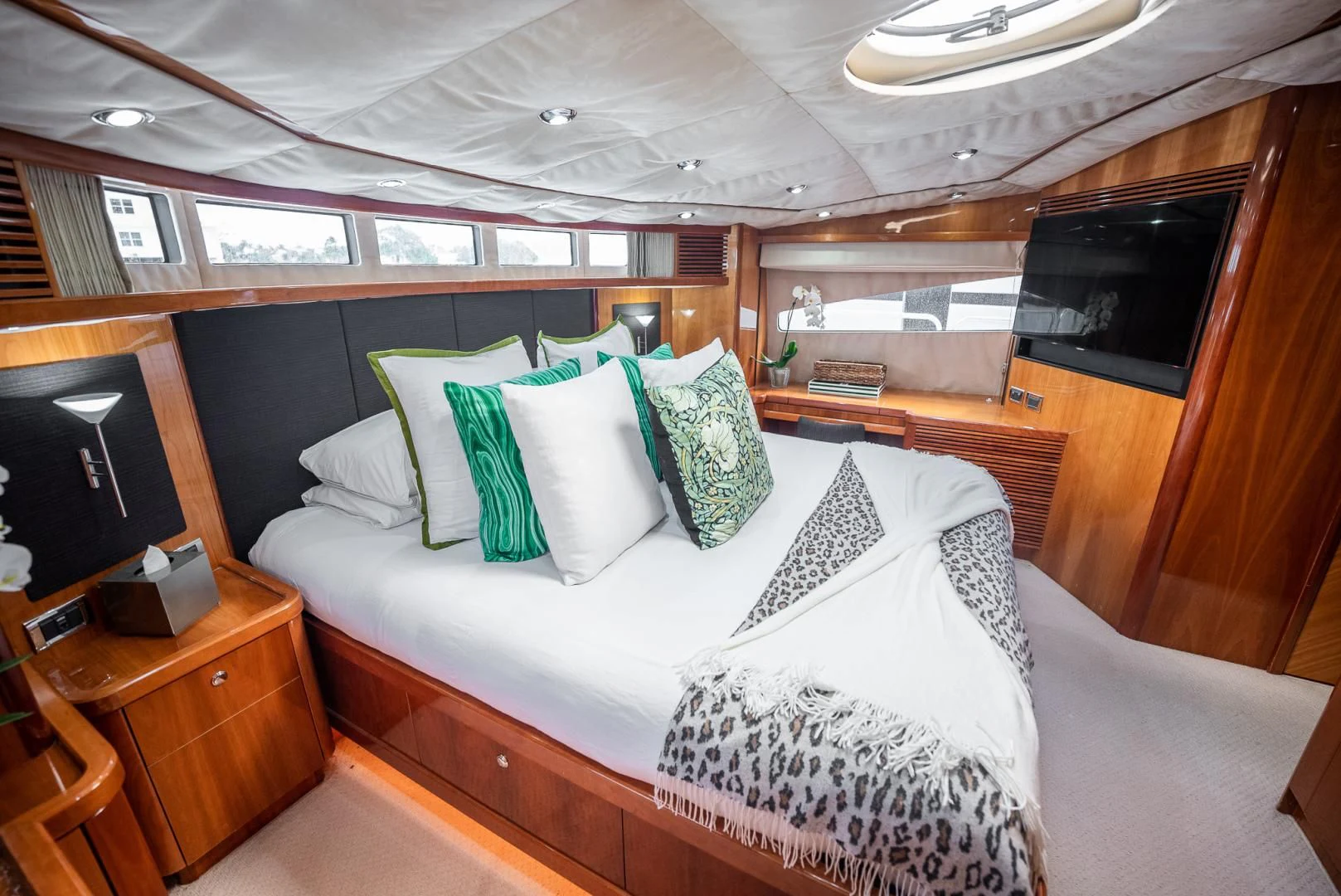 a bed with pillows and pillows aboard DELFINO Yacht for Sale