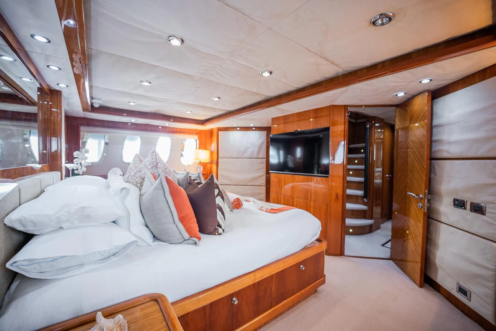 a bedroom with a bed and a television aboard DELFINO Yacht for Sale