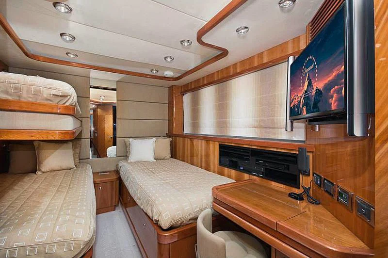 a room with a bed and a tv aboard DELFINO Yacht for Sale
