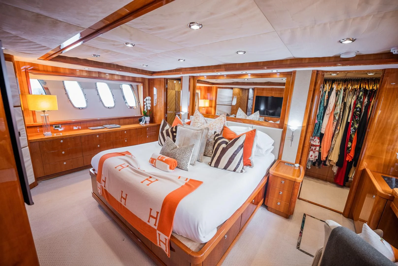 a bedroom with a bed and a window aboard DELFINO Yacht for Sale