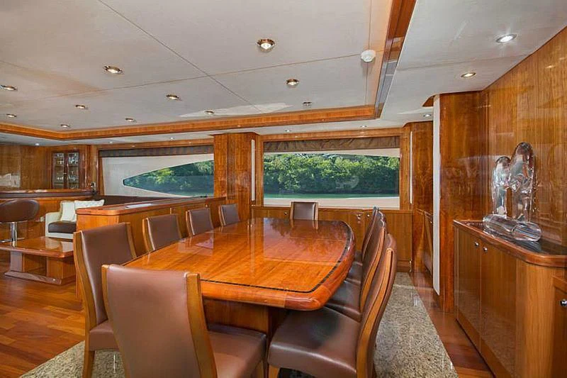 a room with a table chairs and a window aboard DELFINO Yacht for Sale