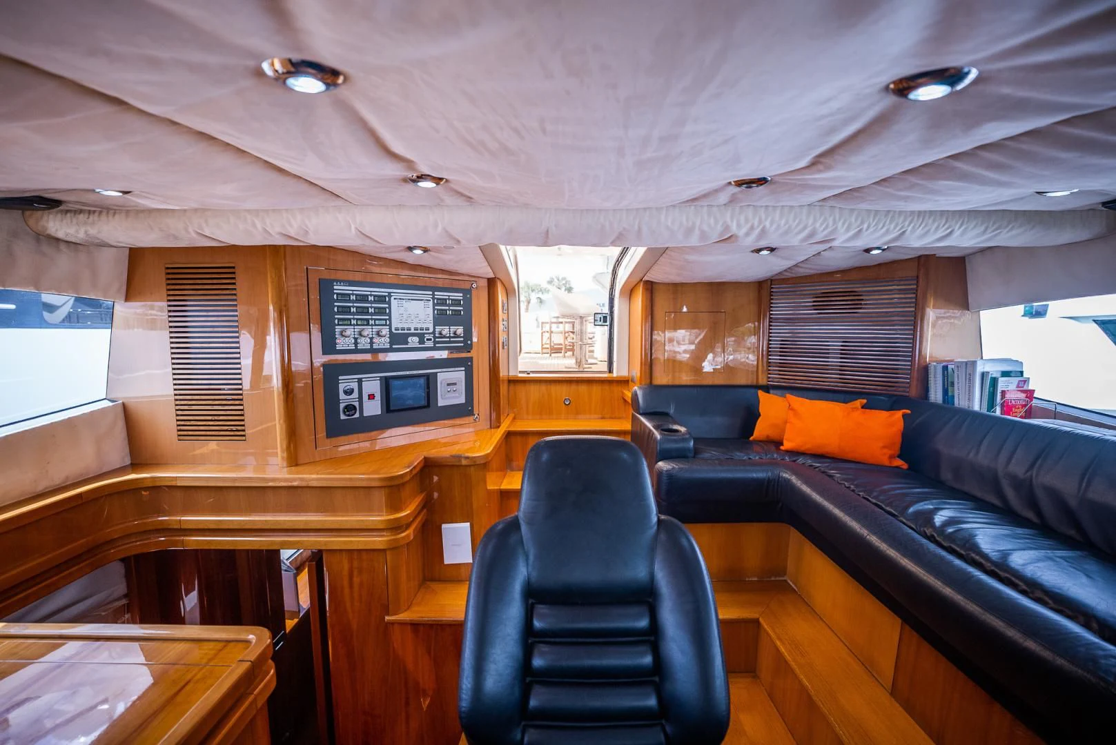 a room with a couch and a chair aboard DELFINO Yacht for Sale