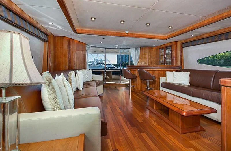 a living room with a large window aboard DELFINO Yacht for Sale