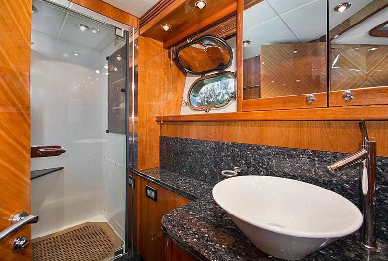a bathroom with a sink and a mirror aboard DELFINO Yacht for Sale