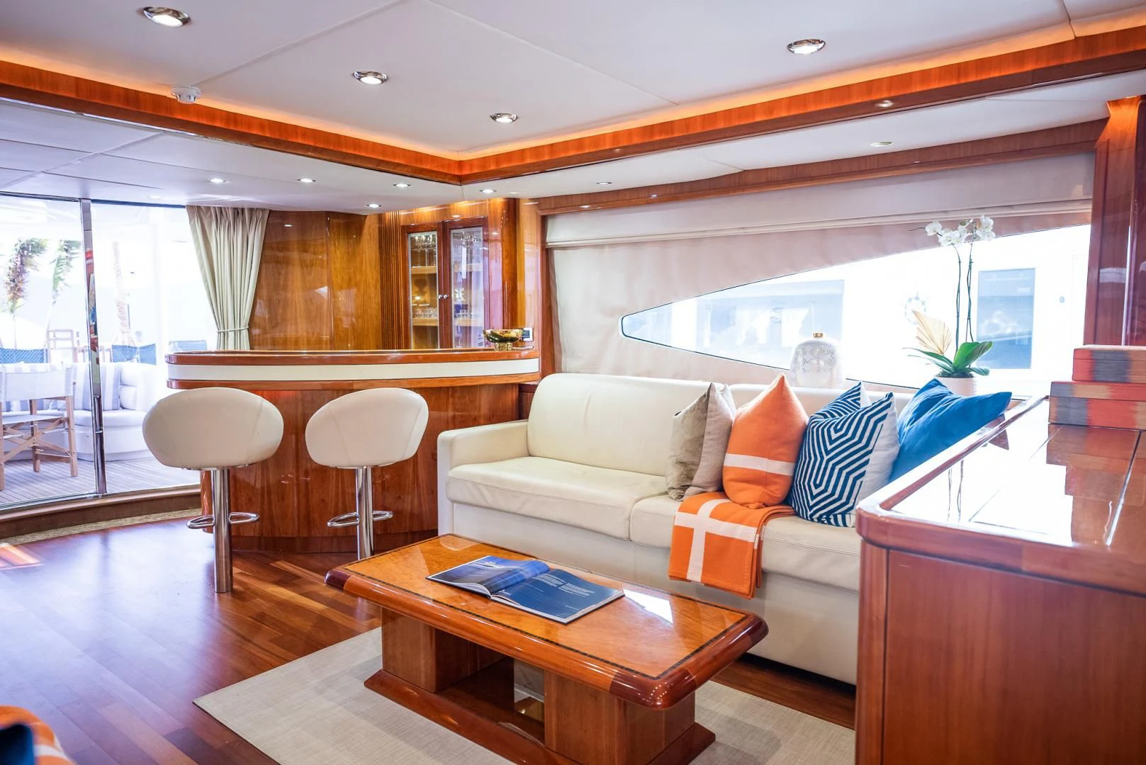 a living room with a couch and a table aboard DELFINO Yacht for Sale