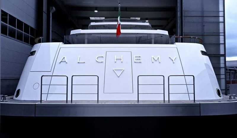 a white vehicle with a red stripe aboard LASATA Yacht for Sale