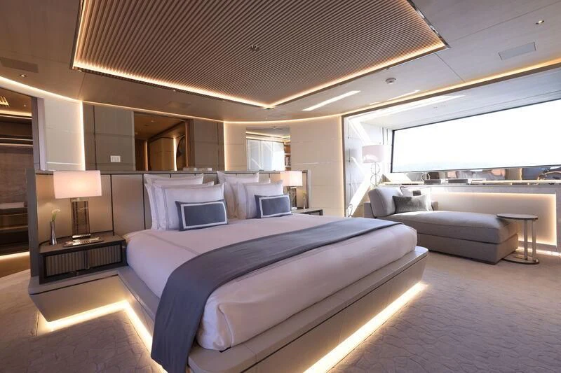 a bedroom with a bed and a desk aboard LASATA Yacht for Sale