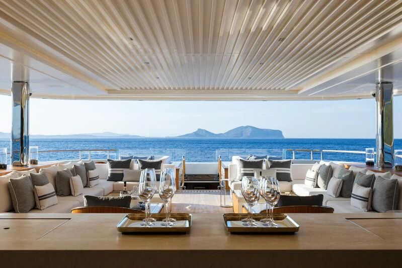 a large living room with a large view of the ocean aboard LASATA Yacht for Sale