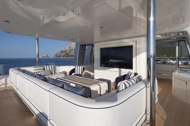 a room with a large bed and a flat screen tv aboard LASATA Yacht for Sale