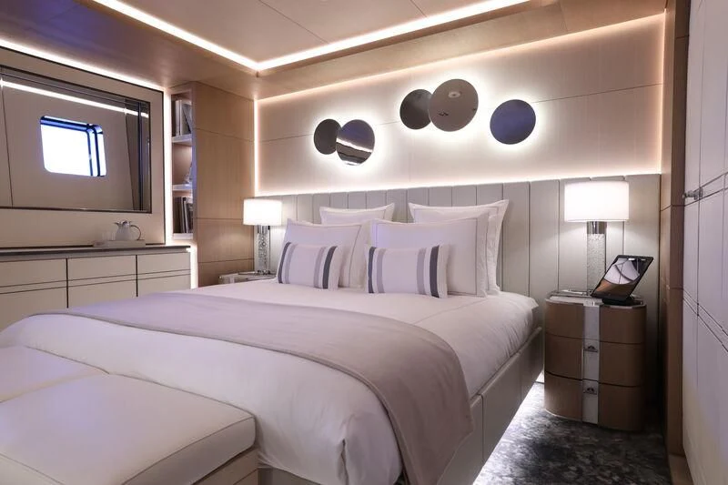 a bedroom with a large bed aboard LASATA Yacht for Sale