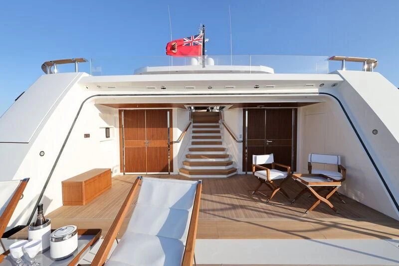 a building with a staircase and chairs aboard LASATA Yacht for Sale