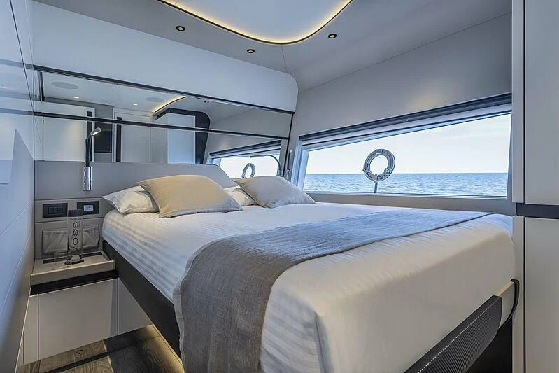 a room with a bed and a window aboard ALDABRA Yacht for Sale