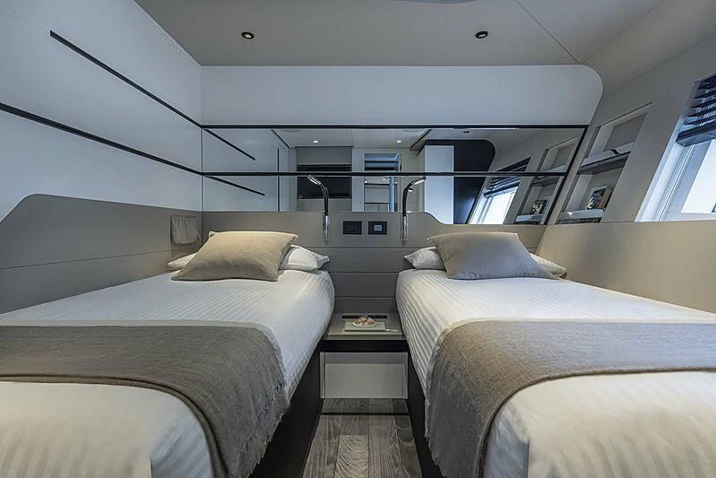 a room with bunk beds aboard ALDABRA Yacht for Sale
