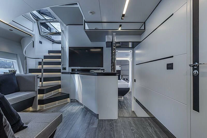 a room with a large tv and a couch aboard ALDABRA Yacht for Sale