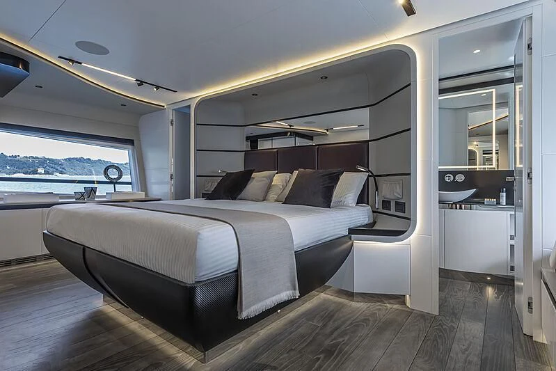 a room with a bed and a window aboard ALDABRA Yacht for Sale