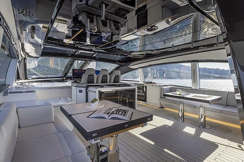 a room with a table and chairs aboard ALDABRA Yacht for Sale