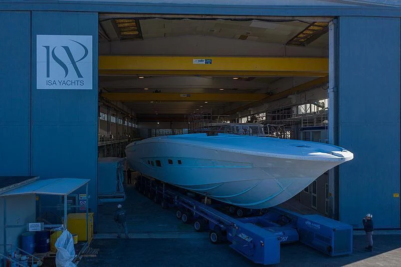 a large white airplane in a warehouse aboard ALDABRA Yacht for Sale