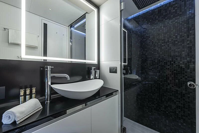 a bathroom with a sink and a shower aboard ALDABRA Yacht for Sale