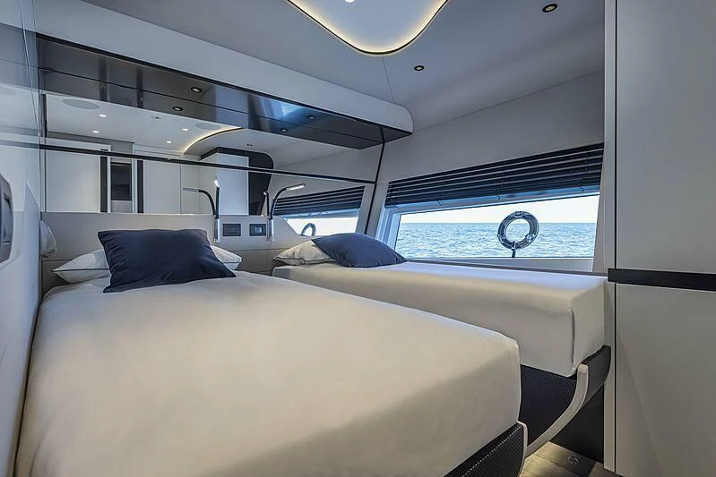 a room with two beds aboard ALDABRA Yacht for Sale