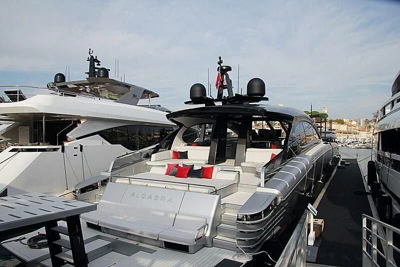 a boat docked at a pier aboard ALDABRA Yacht for Sale
