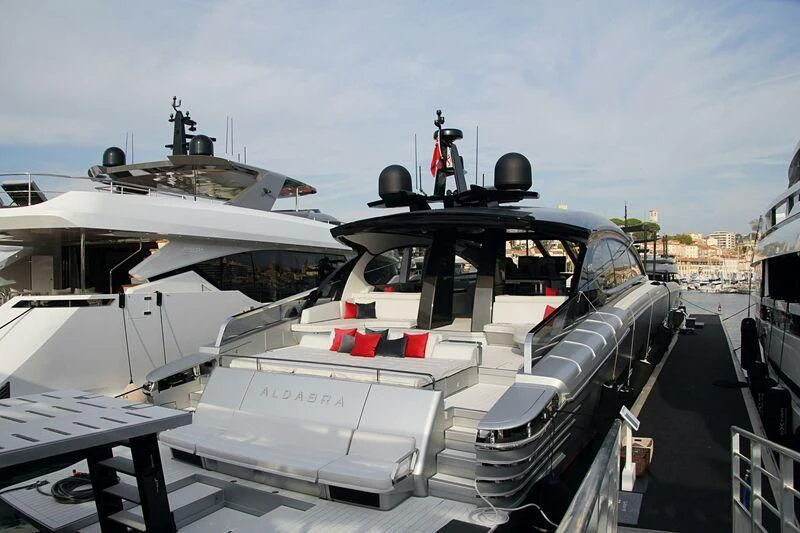 a boat docked at a pier aboard ALDABRA Yacht for Sale