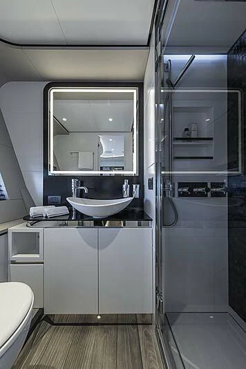 a bathroom with a large mirror aboard ALDABRA Yacht for Sale