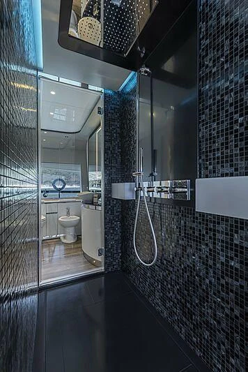 a bathroom with a shower and toilet aboard ALDABRA Yacht for Sale