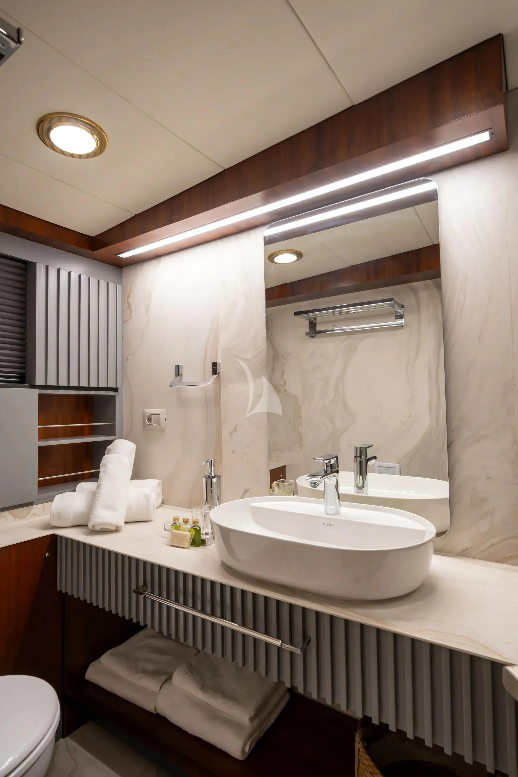 a bathroom with a large mirror aboard NURTEN A Yacht for Sale