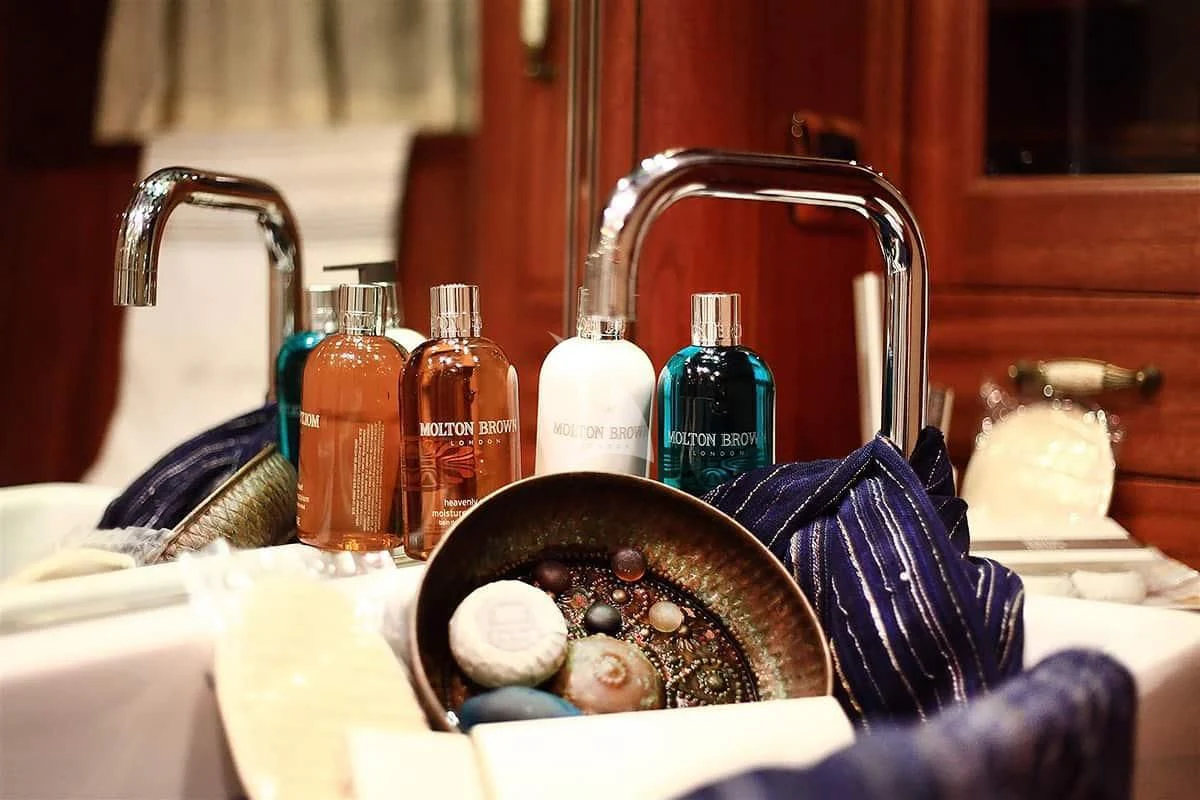 a sink full of soap and bottles aboard NURTEN A Yacht for Sale