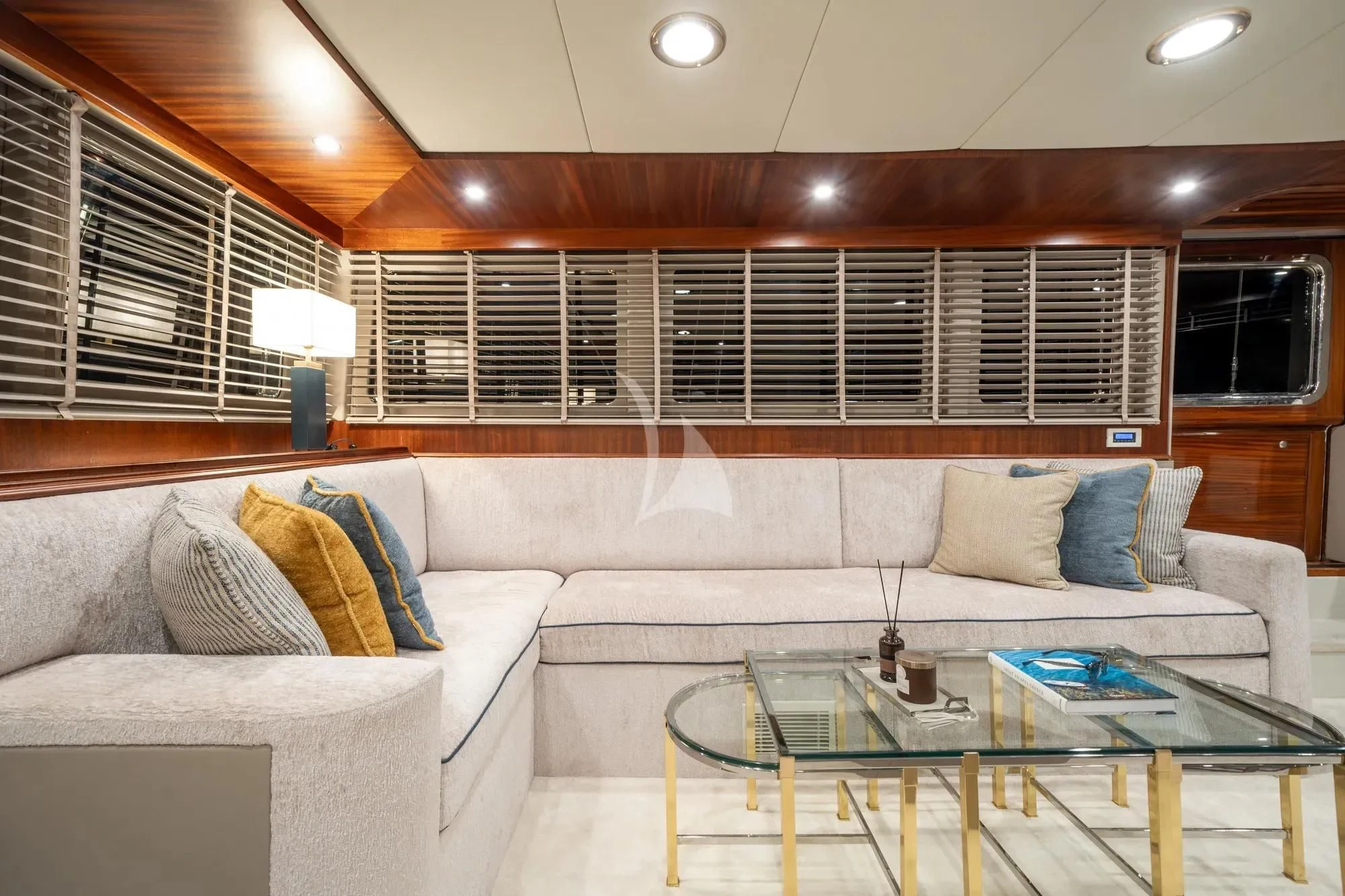a living room with a couch and a table aboard NURTEN A Yacht for Sale