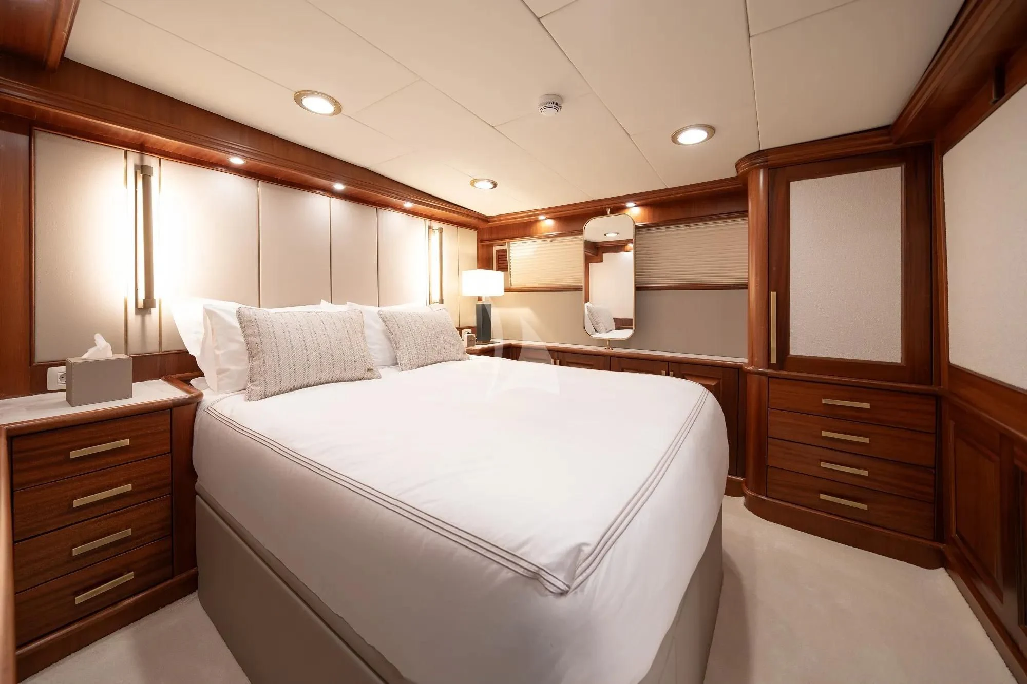 a bedroom with a bed and a dresser aboard NURTEN A Yacht for Sale